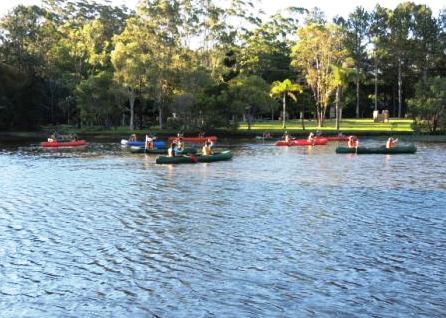 Students in kayaks on river